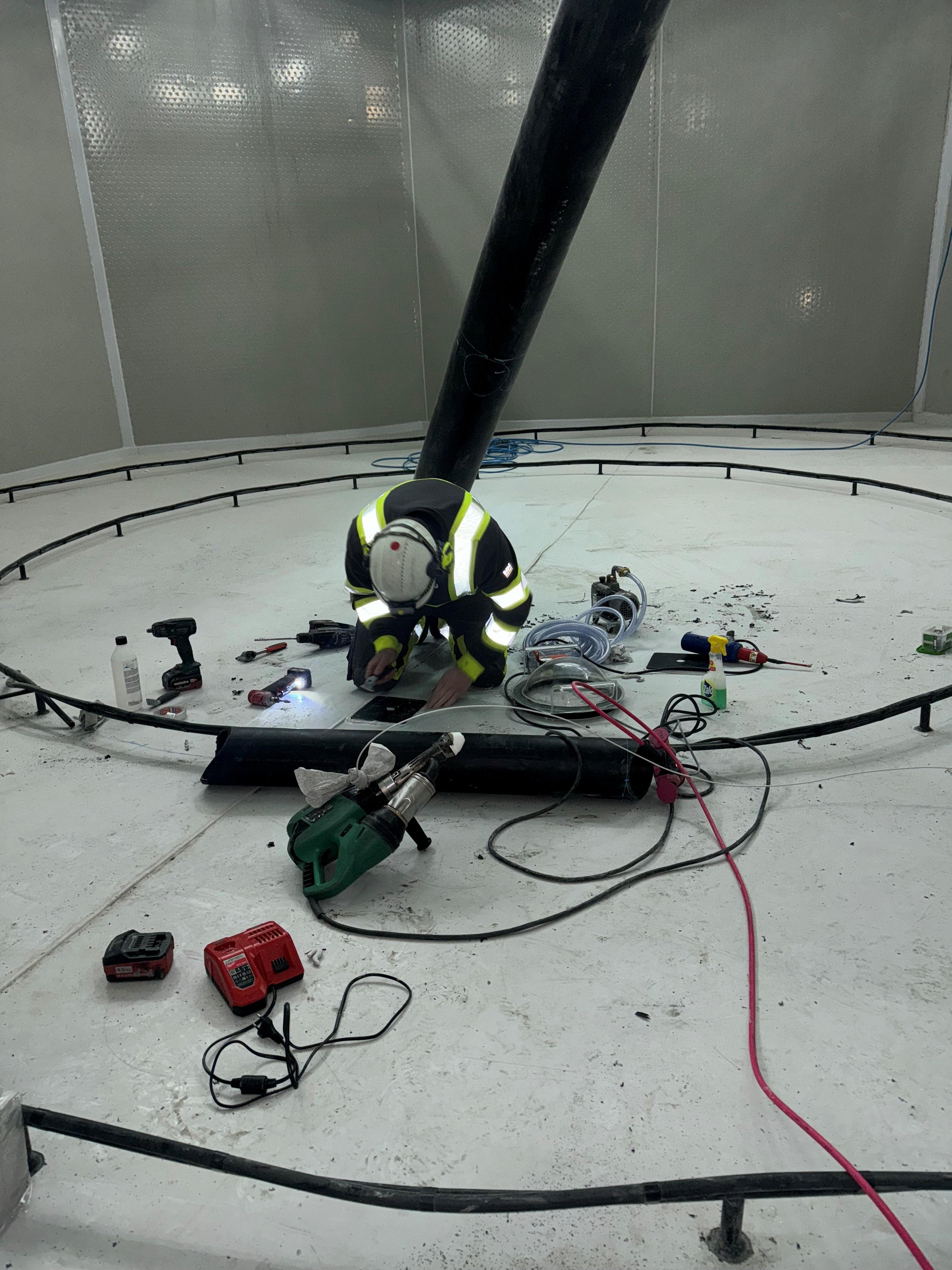 AQ Solutions welder working inside an aquaculture tank