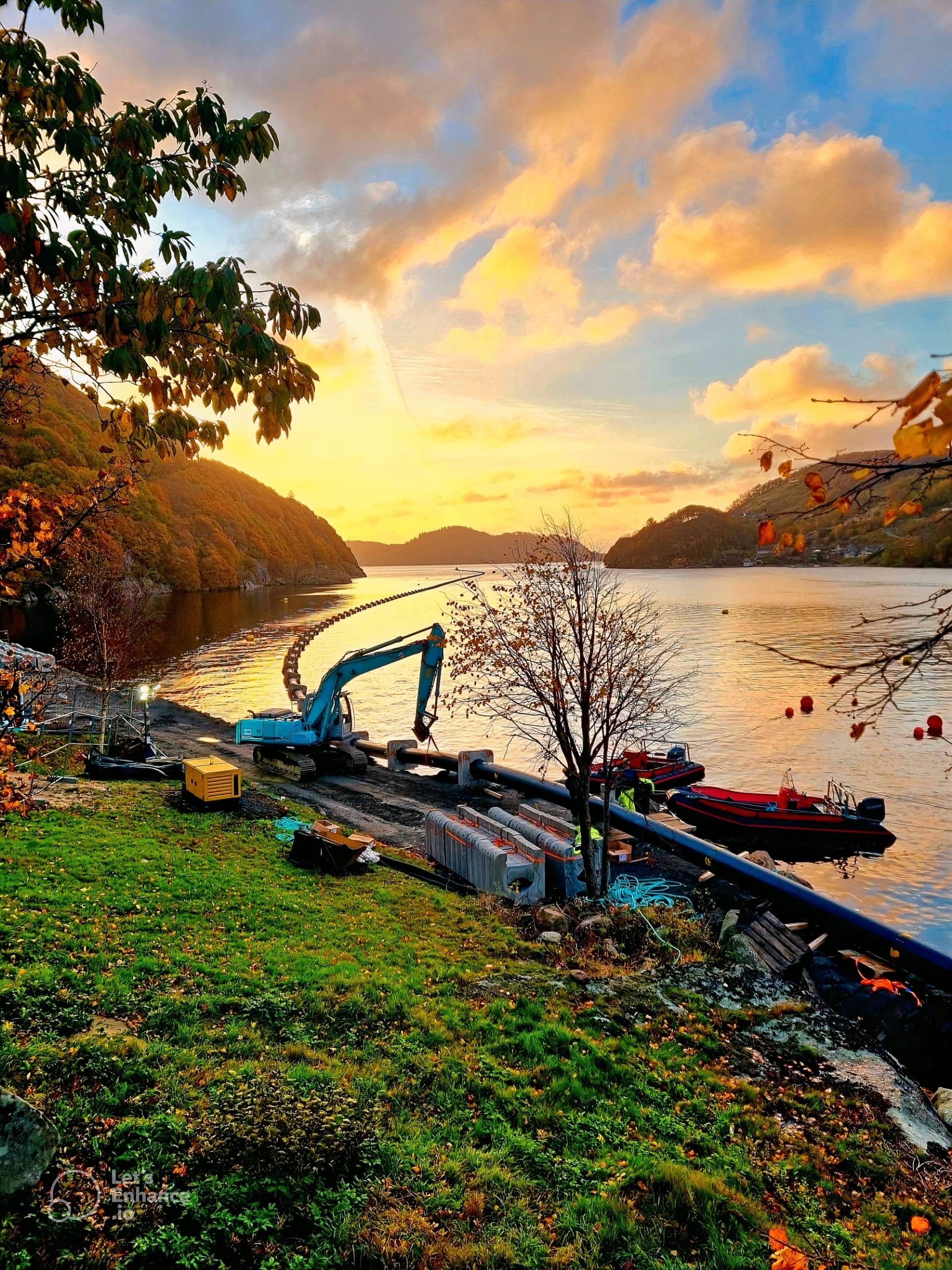 AQ Solutions pipeline installation at a Norwegian fjord at sunset